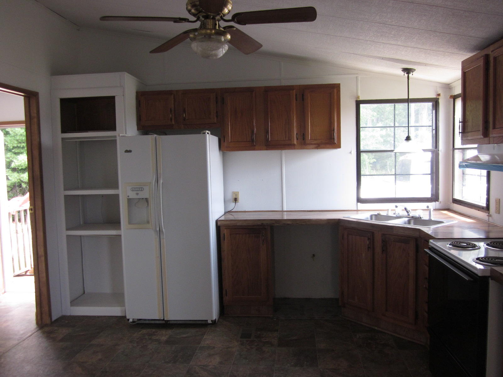 365 Ruritan Road Rocky Mount, VA 24151 - Photo 7 of 33 a kitchen with a refrigerator and a sink