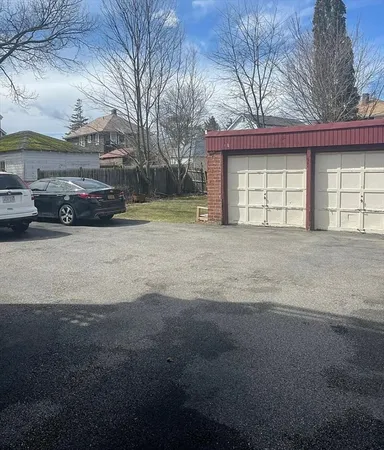 a view of a house with a yard and garage