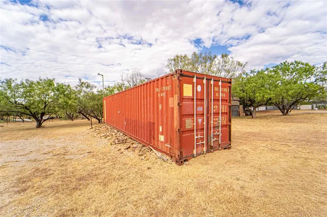 a view of a backyard of the house
