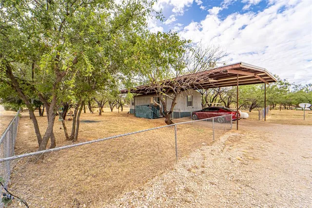 a view of street with large trees