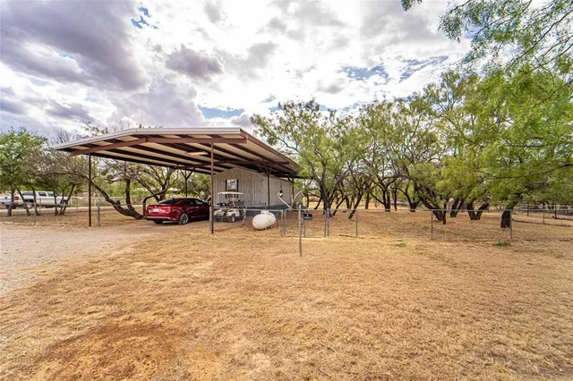 a view of street with parked cars