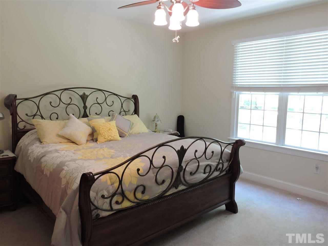 3337 Cates Mill Road Roxboro, NC 27574 - Photo 11 of 25 a bedroom with a bed and a window