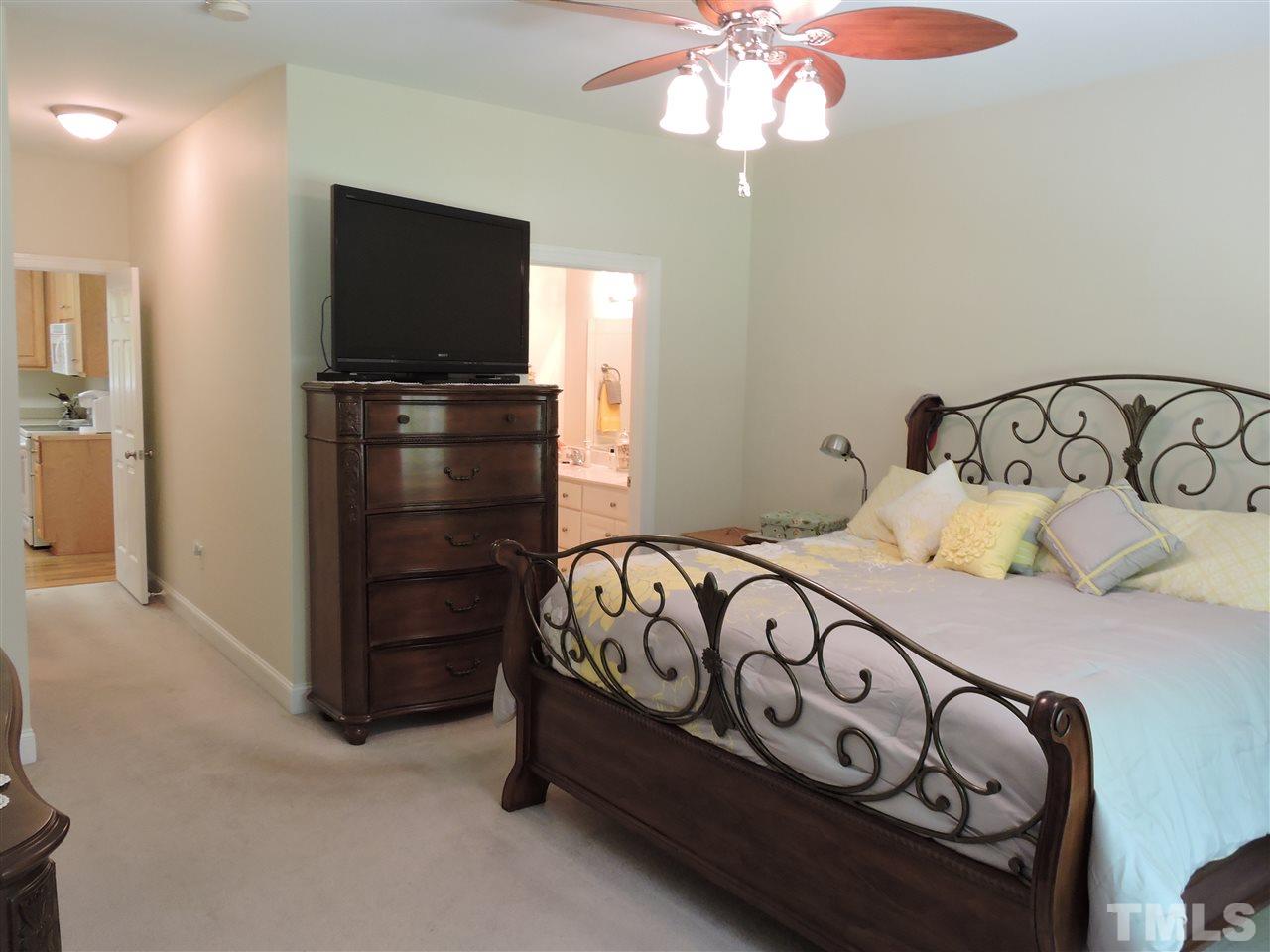 3337 Cates Mill Road Roxboro, NC 27574 - Photo 12 of 25 a bedroom with a bed and a tv