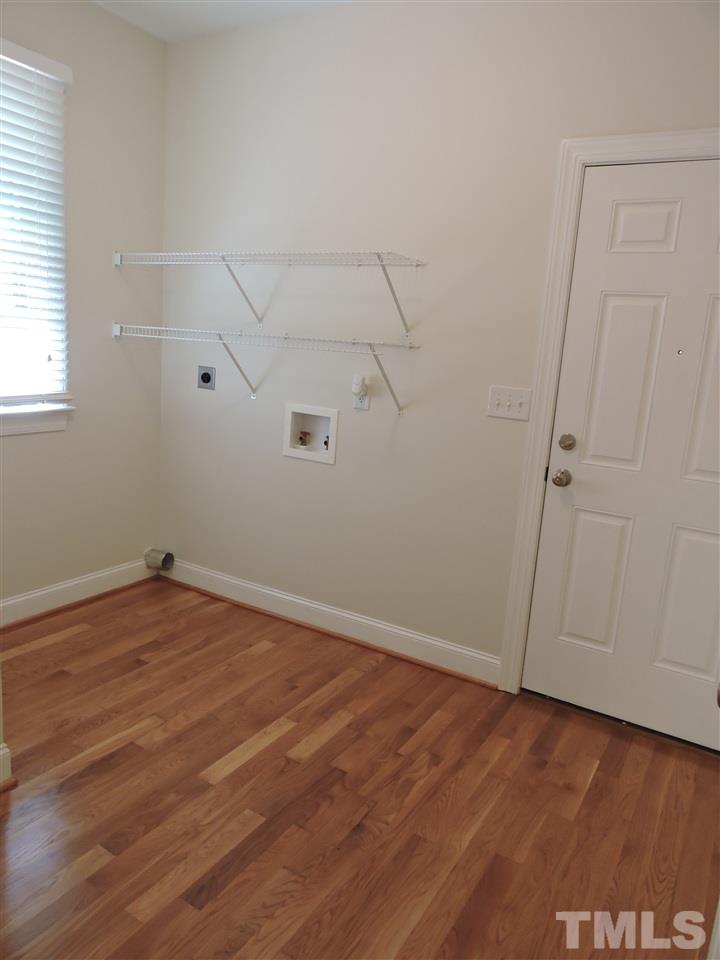 3337 Cates Mill Road Roxboro, NC 27574 - Photo 15 of 25 an empty room with wooden floor and windows
