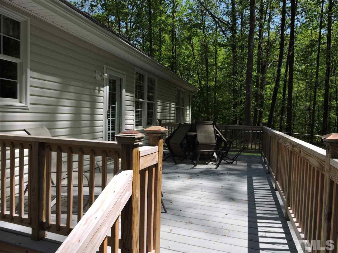 3337 Cates Mill Road Roxboro, NC 27574 - Photo 16 of 25 a view of deck with chairs and wooden fence