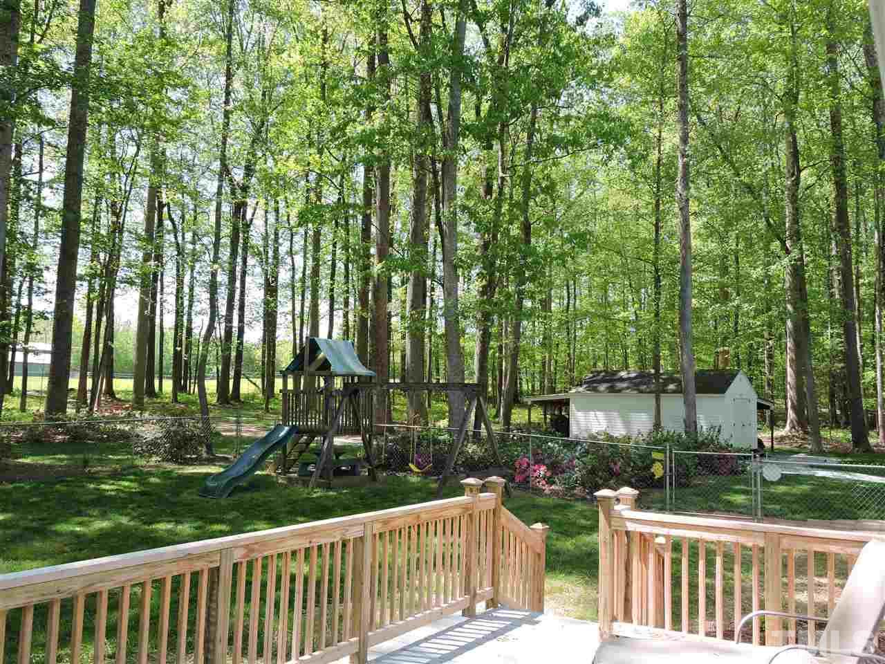 3337 Cates Mill Road Roxboro, NC 27574 - Photo 17 of 25 a city view with tall trees