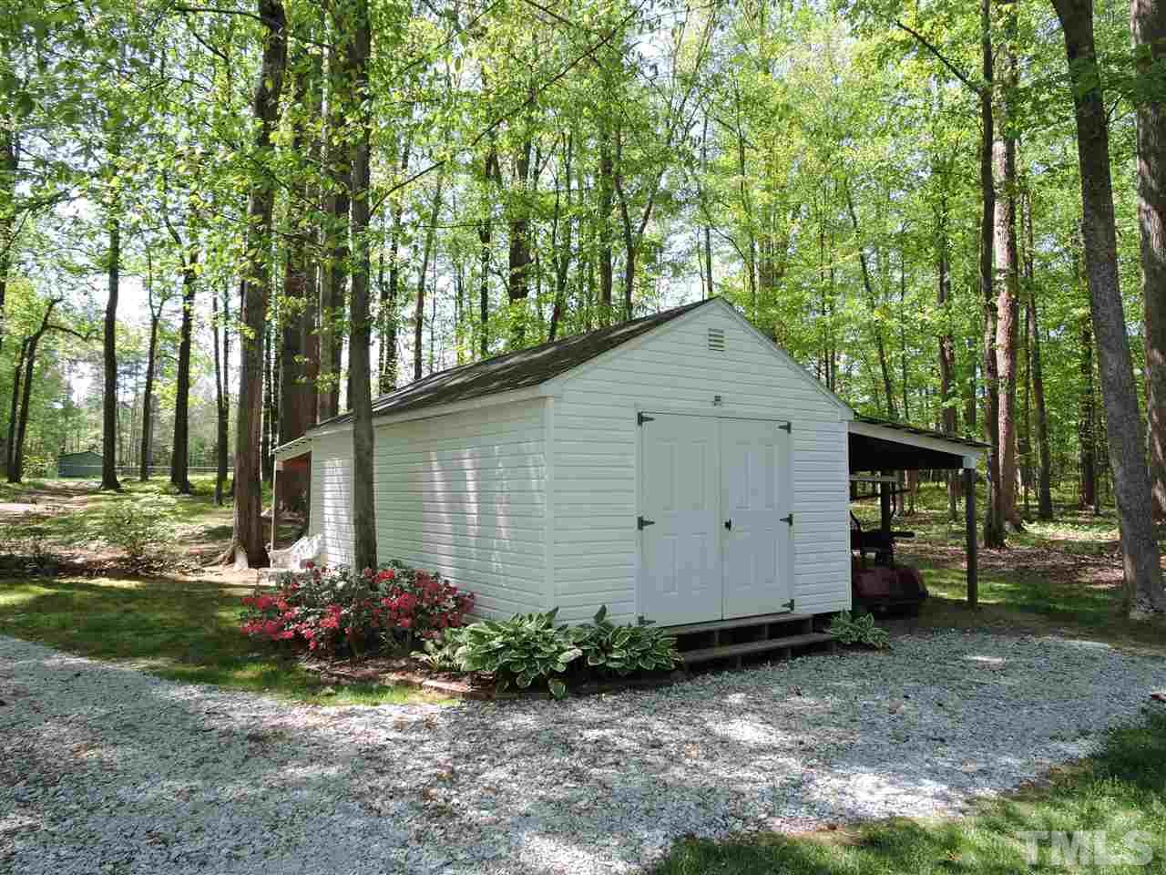 3337 Cates Mill Road Roxboro, NC 27574 - Photo 19 of 25 a front view of a house with a yard