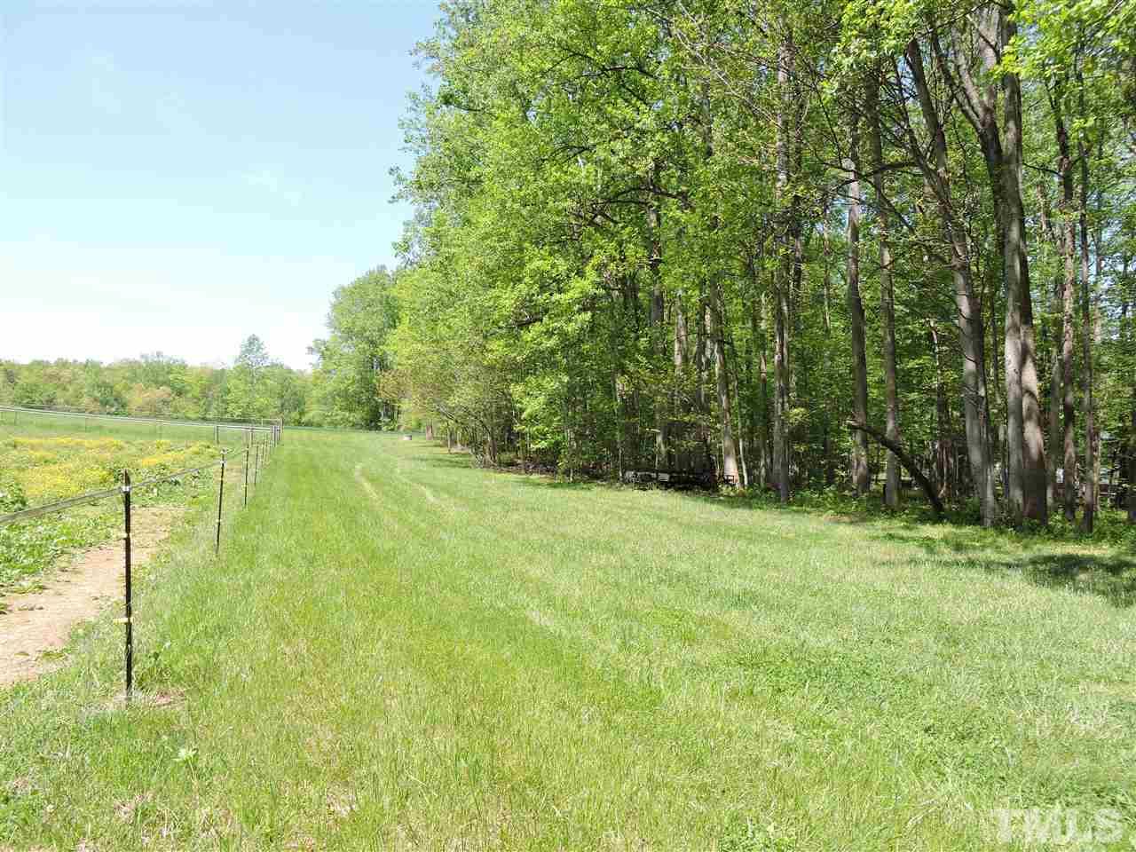 3337 Cates Mill Road Roxboro, NC 27574 - Photo 22 of 25 a view of a field with an outdoor space