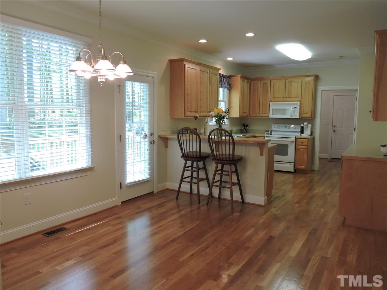 3337 Cates Mill Road Roxboro, NC 27574 - Photo 4 of 25 a view of a dining room with furniture window and wooden floor