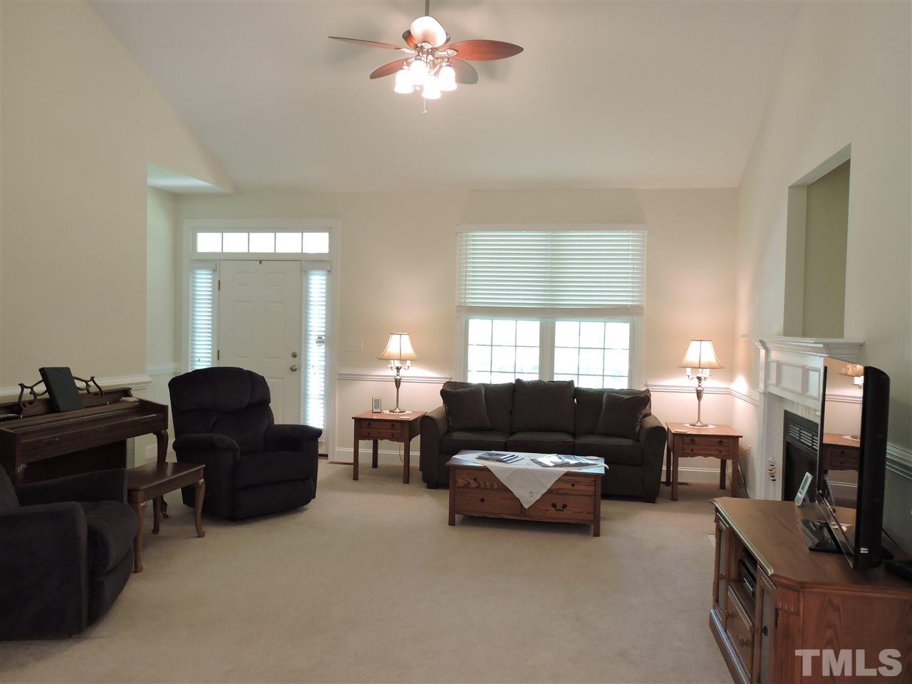 3337 Cates Mill Road Roxboro, NC 27574 - Photo 5 of 25 a living room with furniture and a flat screen tv