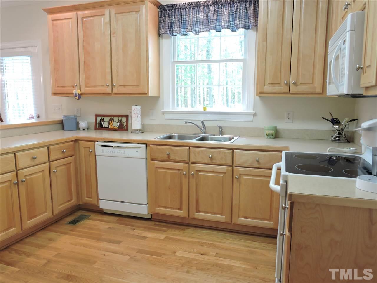 3337 Cates Mill Road Roxboro, NC 27574 - Photo 7 of 25 a kitchen with sink cabinets and window