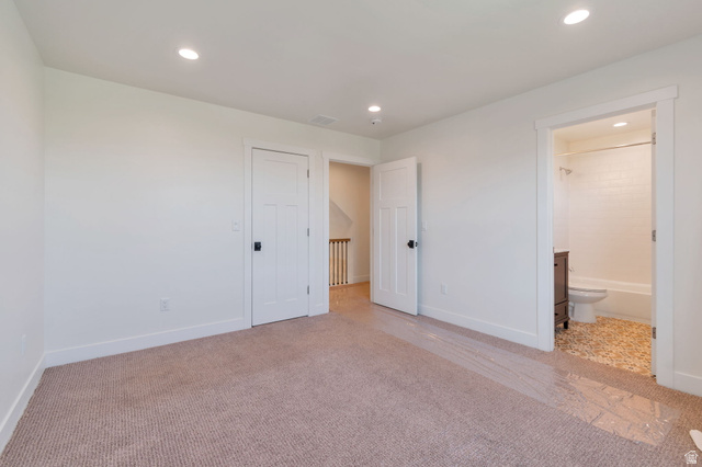 1820 West Farmhouse Flats Road Peoa, UT 84061 - Photo 33 of 79 Neutral tone carpeting with white baseboards and walls