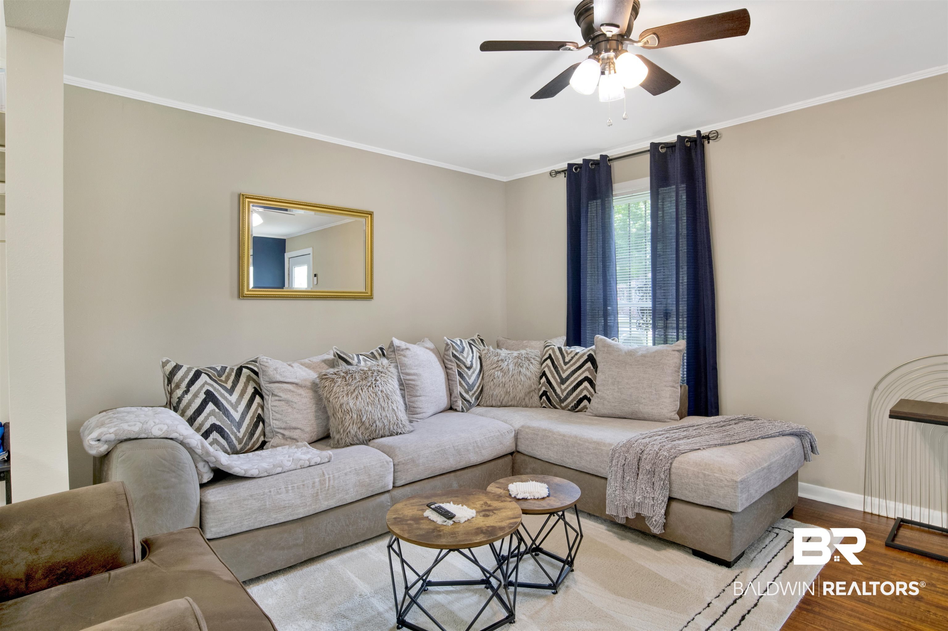 1476 Boudousquie Street Mobile, AL 36605 - Photo 6 of 34 Living room with a ceiling fan, wood finished floors, and ornamental molding