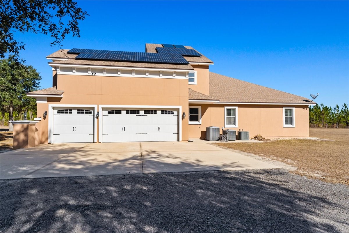 27247 Hallman Road Hilliard, FL 32046 - Photo 8 of 59 a view of a house with a patio