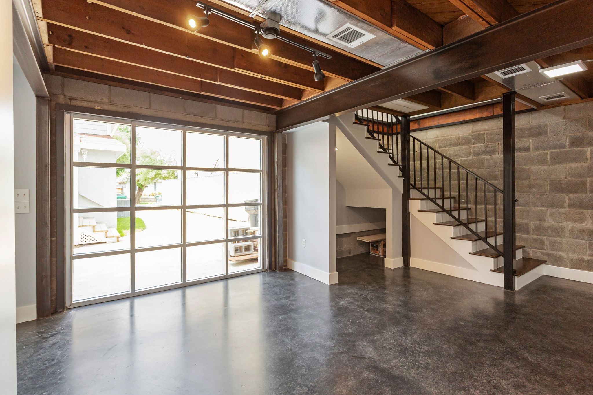 2005 Portsmouth Street, Unit C Houston, TX 77098 - Photo 11 of 26 a view of an empty room with wooden floor and stairs