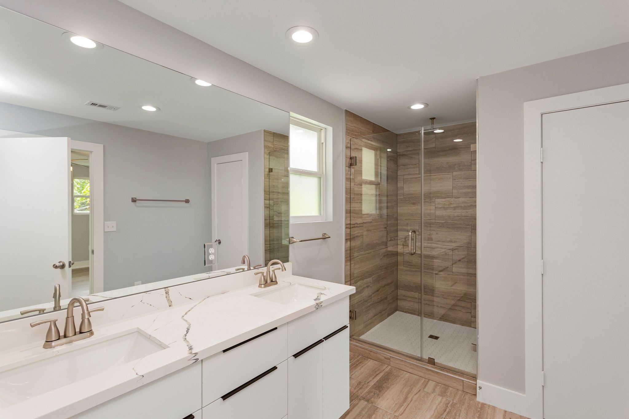 2005 Portsmouth Street, Unit C Houston, TX 77098 - Photo 14 of 26 a bathroom with a shower sink double and mirror