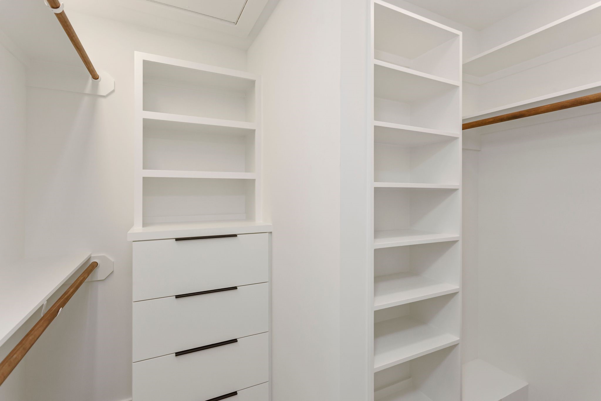 2005 Portsmouth Street, Unit C Houston, TX 77098 - Photo 18 of 26 a view of walk in closet with empty racks