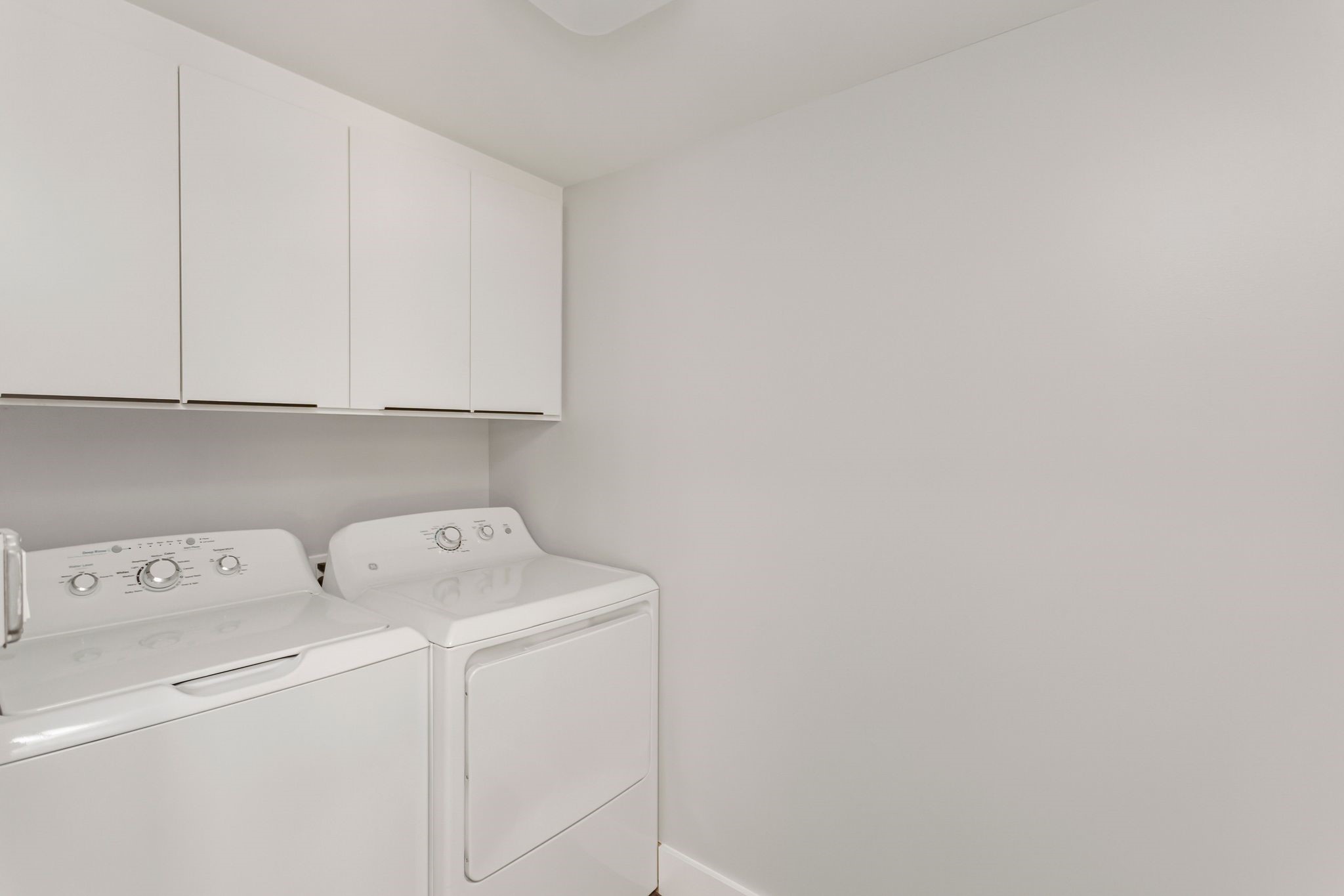 2005 Portsmouth Street, Unit C Houston, TX 77098 - Photo 19 of 26 a utility room with dryer and washer