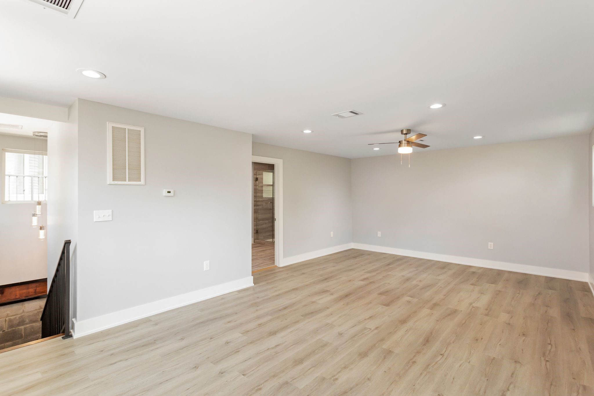 2005 Portsmouth Street, Unit C Houston, TX 77098 - Photo 22 of 26 wooden floor in an empty room with a window
