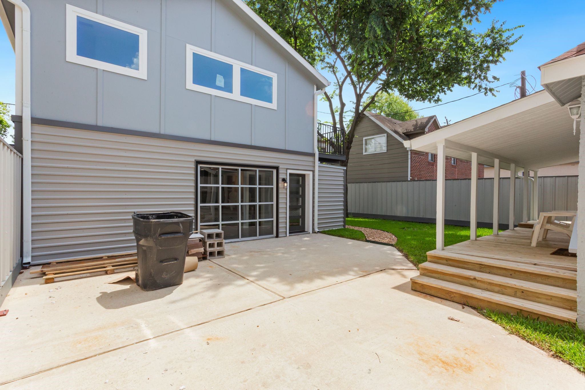 2005 Portsmouth Street, Unit C Houston, TX 77098 - Photo 26 of 26 a view of a backyard with chairs and a tree