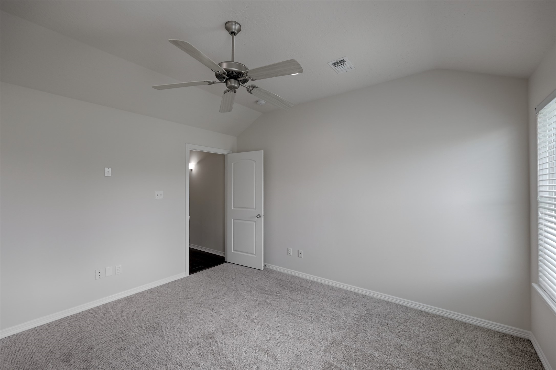 14605 Ophiuchus Court Willis, TX 77318 - Photo 16 of 37 Spacious primary bedroom with private en-suite and walk-in closet.
