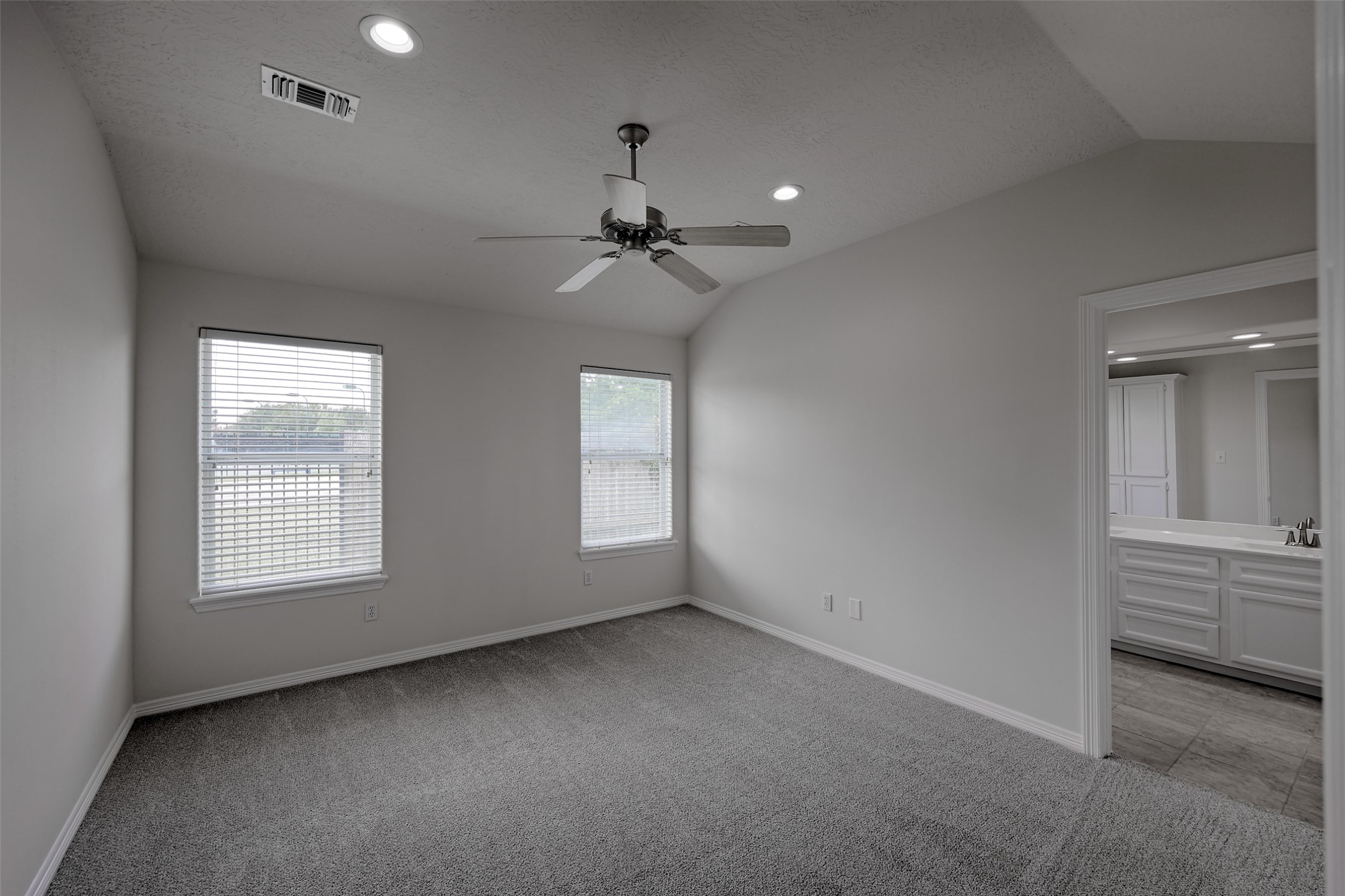 14605 Ophiuchus Court Willis, TX 77318 - Photo 18 of 37 Primary suite with view to backyard.