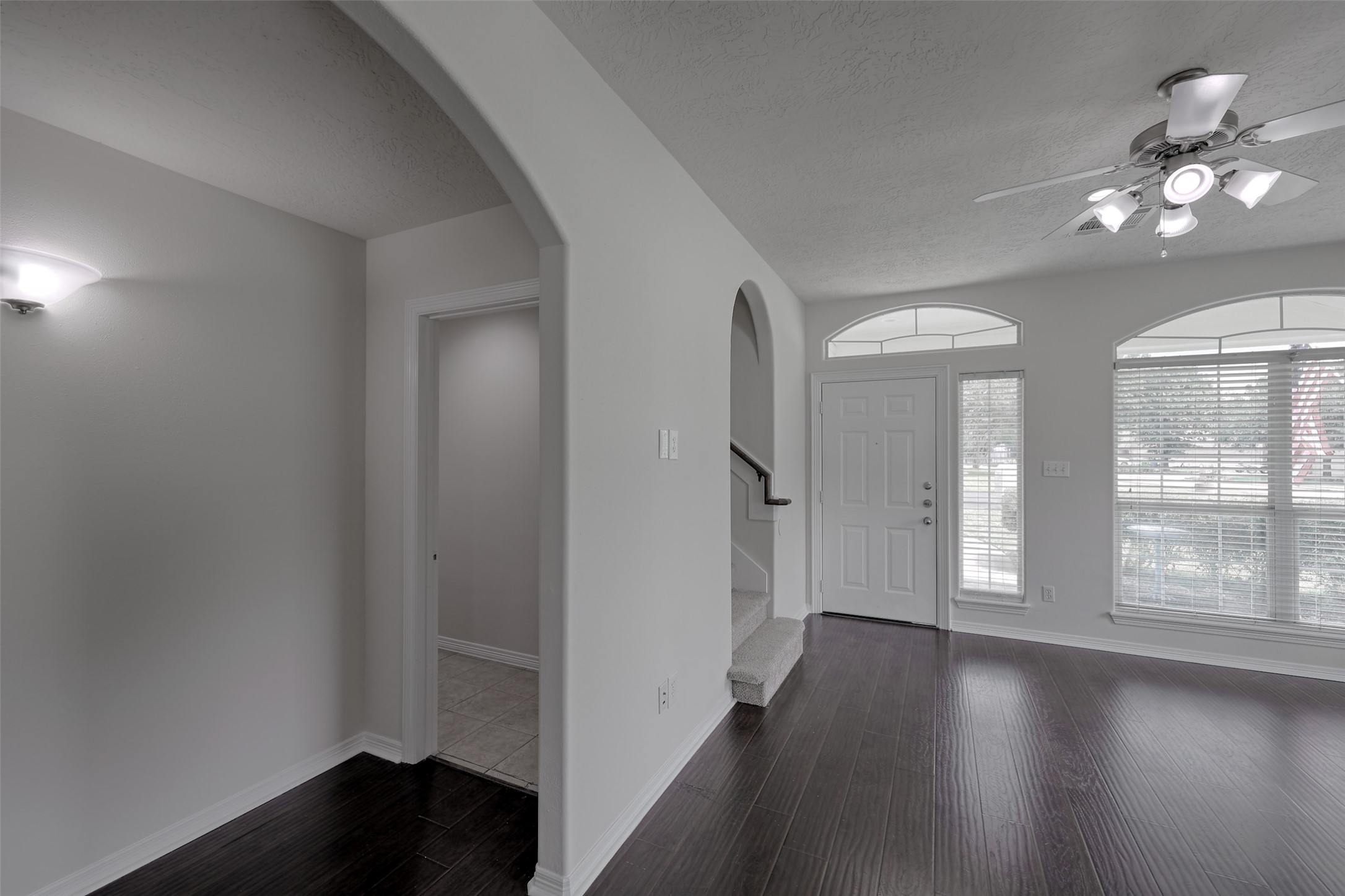 14605 Ophiuchus Court Willis, TX 77318 - Photo 21 of 37 Hallway to the laundry room, and additional downstairs bedroom and bathroom.