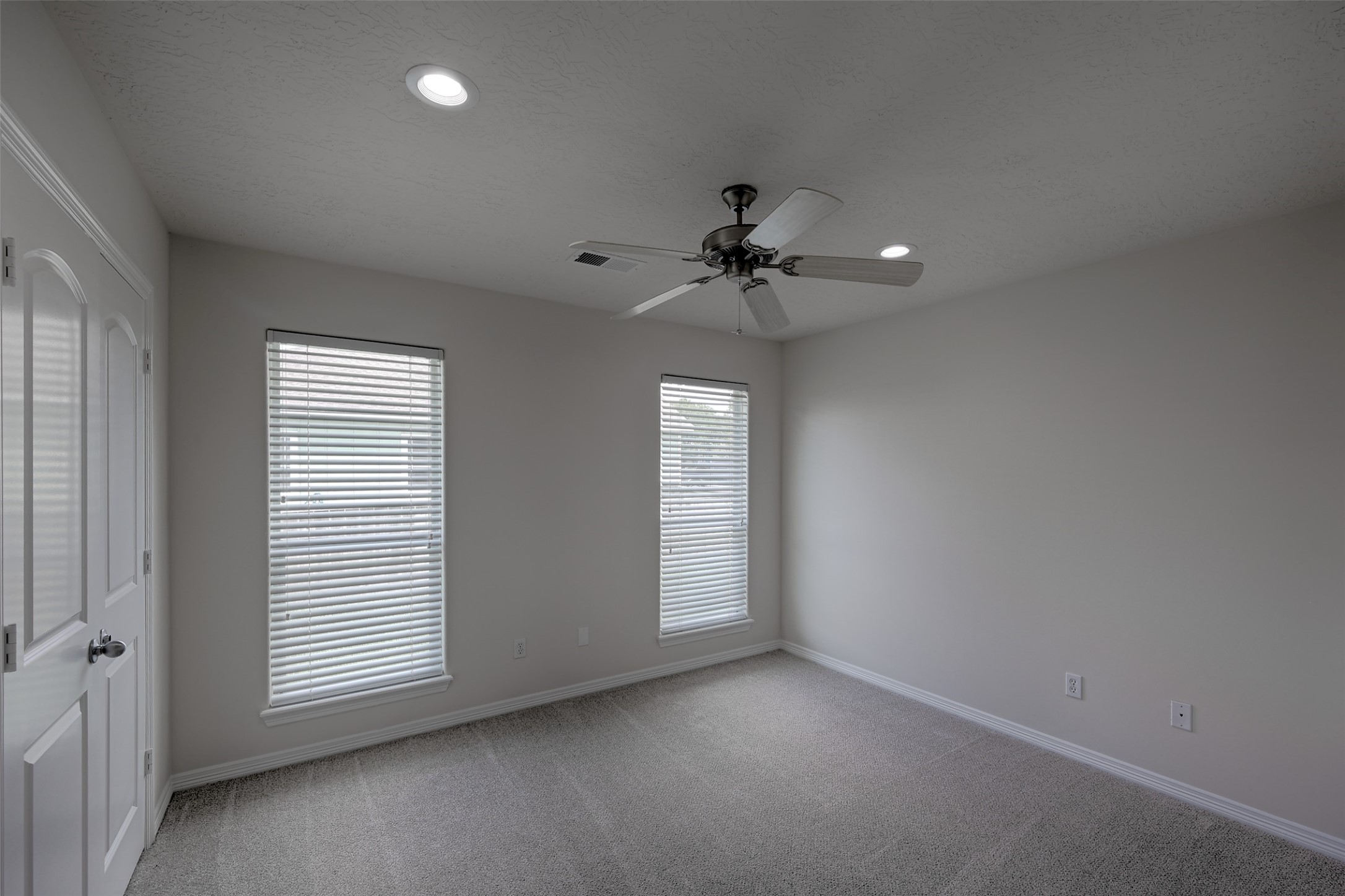 14605 Ophiuchus Court Willis, TX 77318 - Photo 23 of 37 Bedroom 2 on first floor boasts fresh paint and carpet, blinds and ceiling fan!
