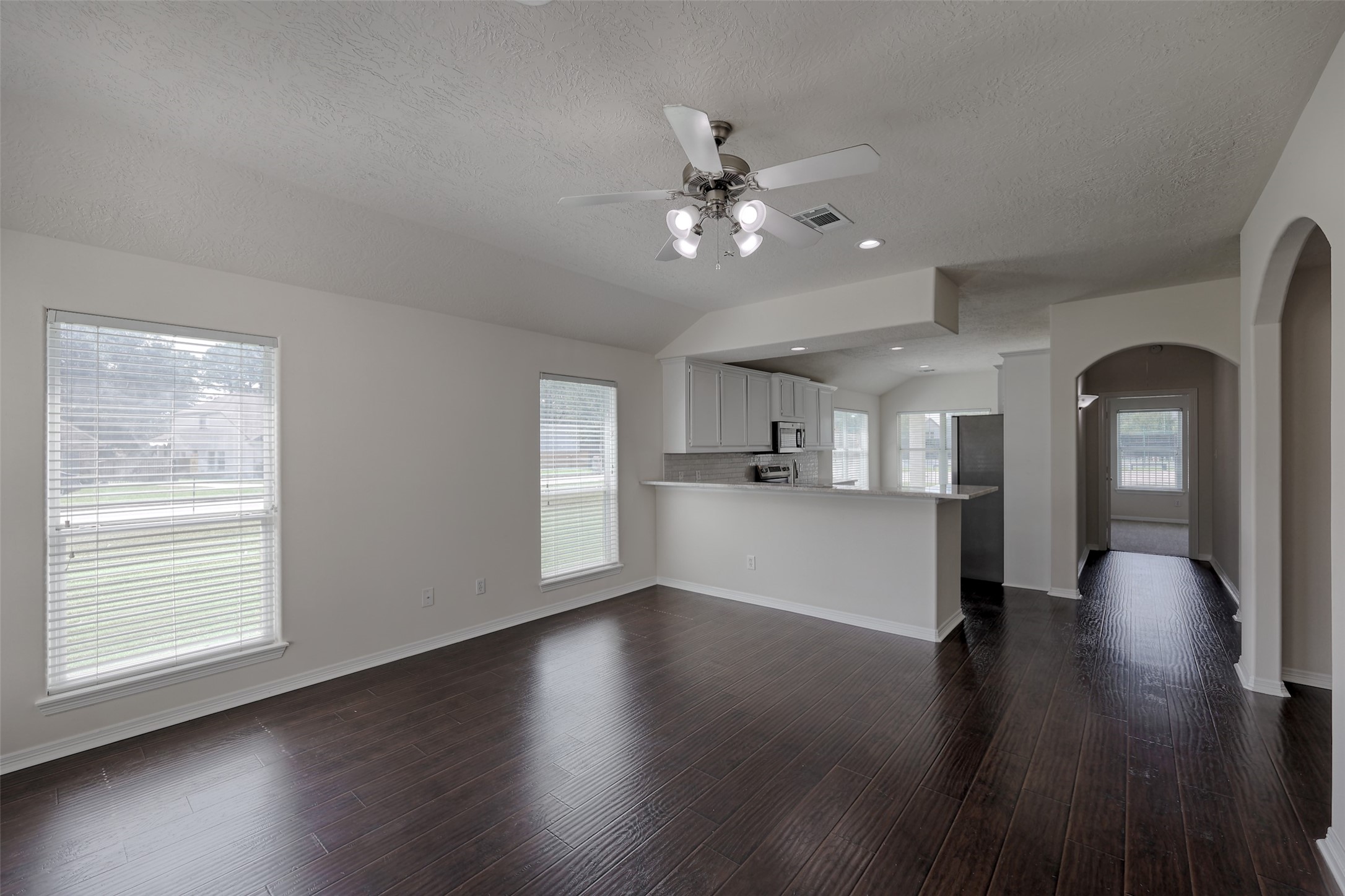 14605 Ophiuchus Court Willis, TX 77318 - Photo 4 of 37 Front door opens into living area.