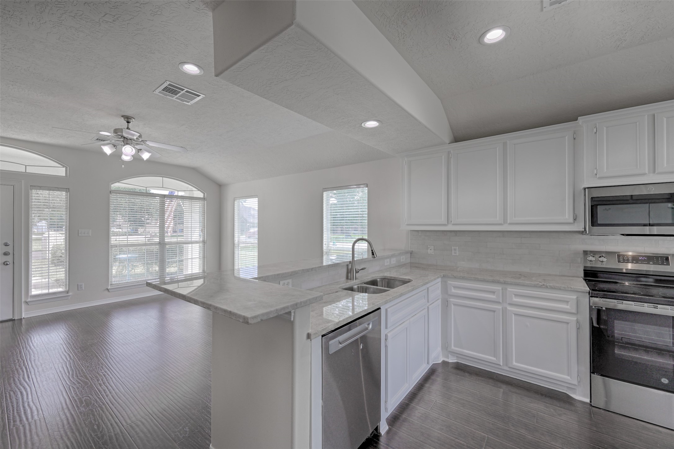 14605 Ophiuchus Court Willis, TX 77318 - Photo 8 of 37 Kitchen overlooks living room and breakfast bar.