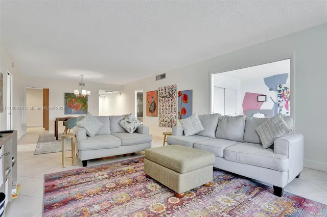 a bed room with two beds and a desk