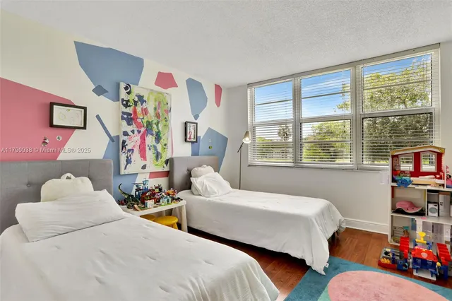 a bedroom with furniture and a window