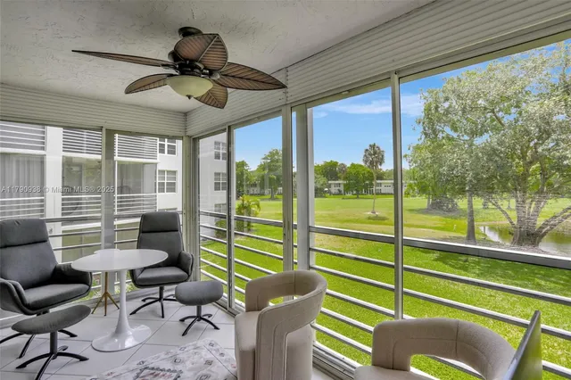 a view of a two chairs in the balcony