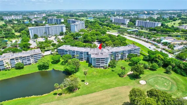 a view of a swimming pool with a garden and plants