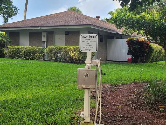 a front view of a house with a yard and outdoor space