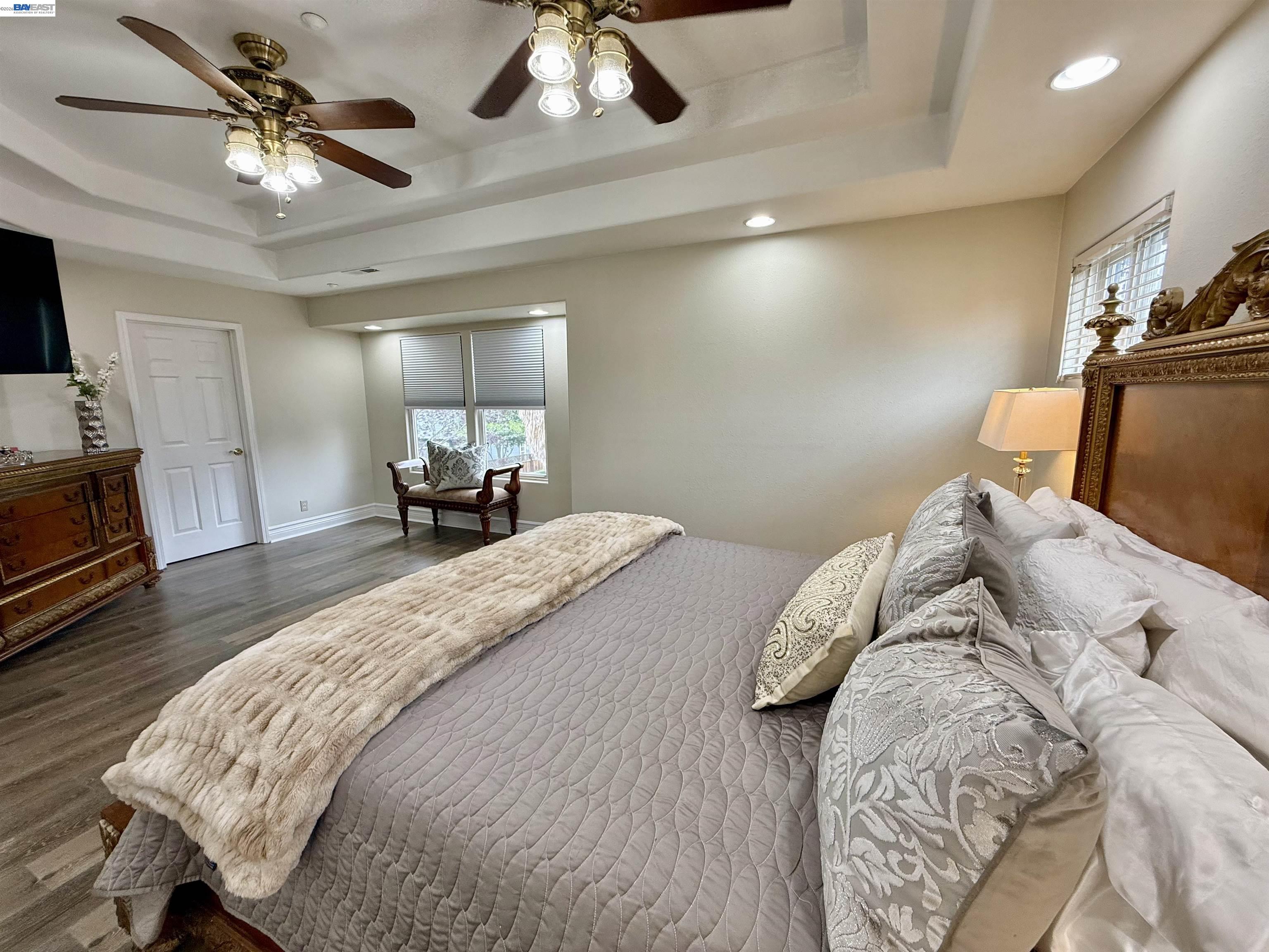 1284 Riesling Circle Livermore, CA 94550 - Photo 48 of 79 a bedroom with a bed and a chandelier
