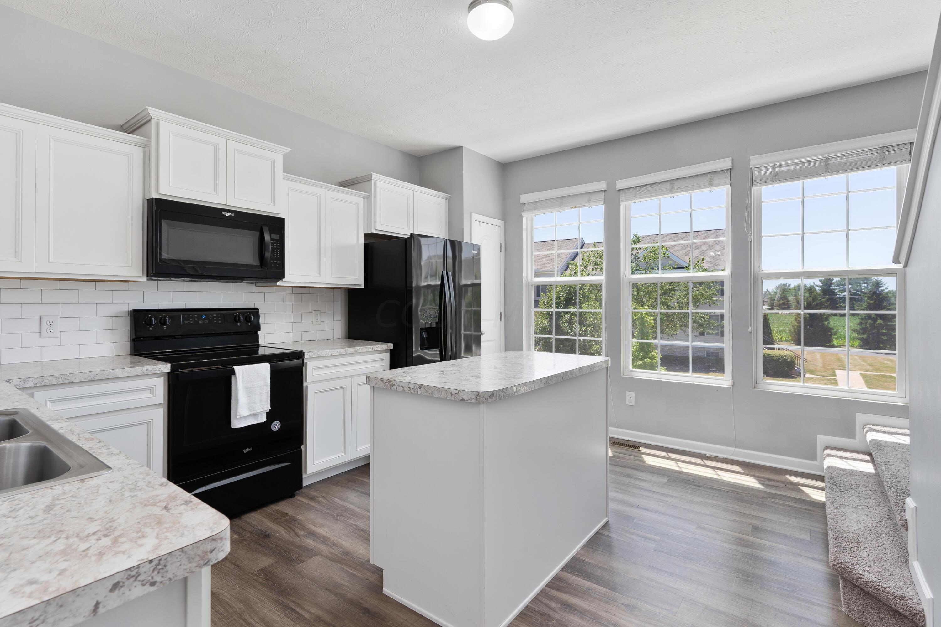 487 Autumn Ridge Circle Pickerington, OH 43147 - Photo 14 of 32 Spacious kitchen with loads of natural light!