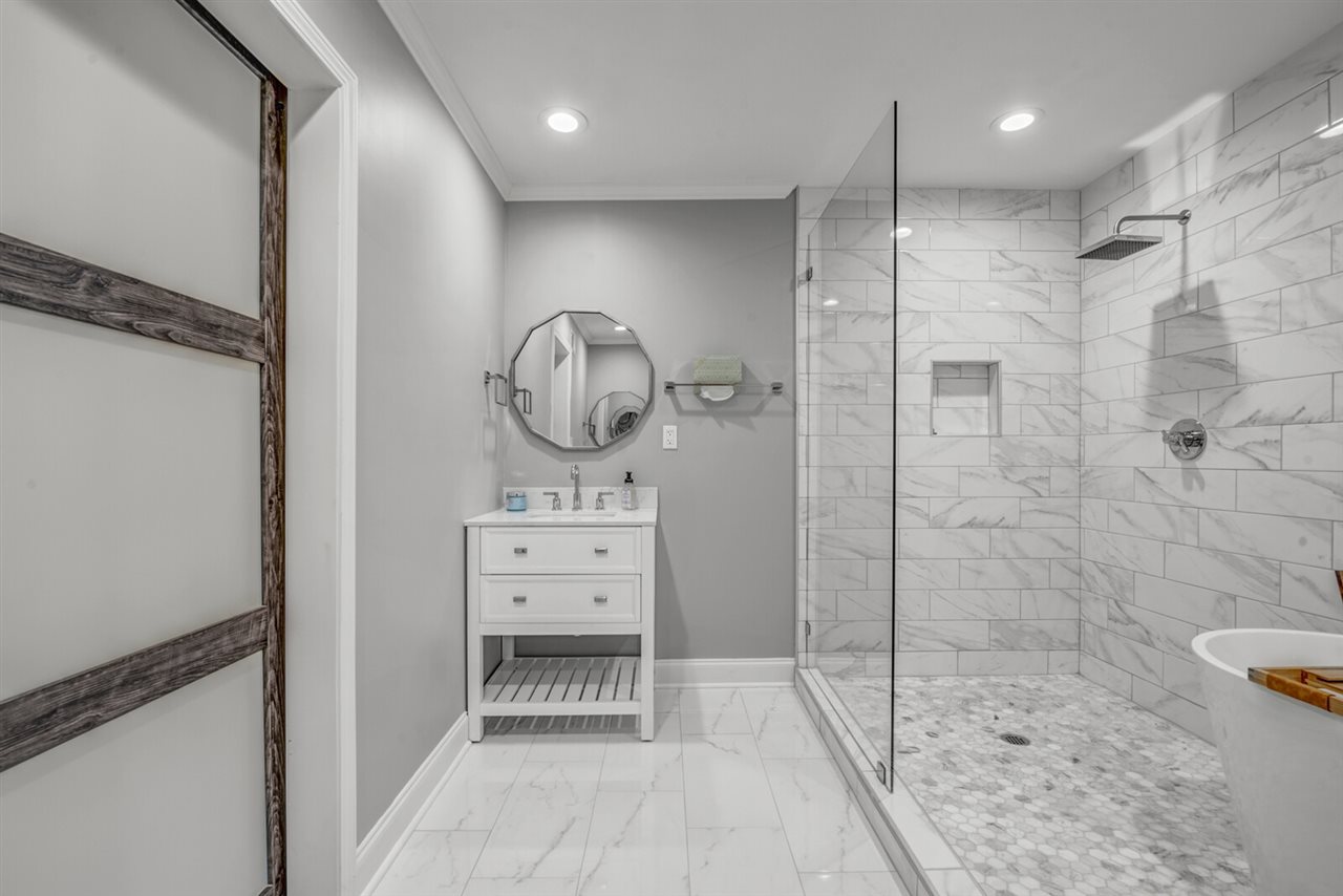 5209 South Angela Road Memphis, TN 38117 - Photo 21 of 25 WOW! This bathroom is a must see with gorgeous marble flooring in the shower and rain style shower head.
