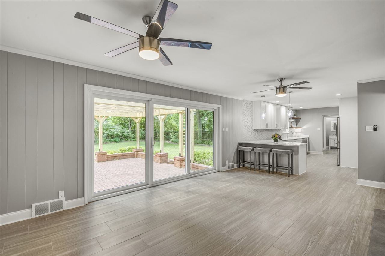 Relaxing den to enjoy the view of your very private backyard. Has a gas fireplace for cold winter nights or enjoy a cold beverage from your wine fridge in the bar area during these hot summer days.
