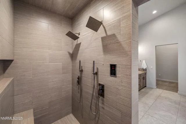 a bathroom with a shower and a mirror