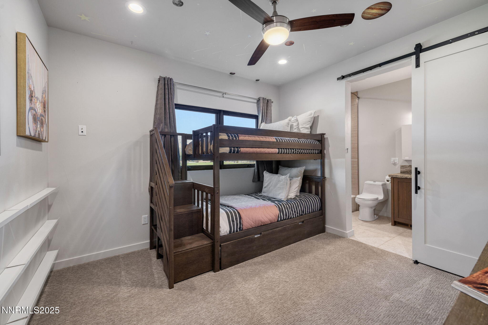 2255 Warrior Lane Reno, NV 89523 - Photo 16 of 52 a bedroom with a bed and a tv