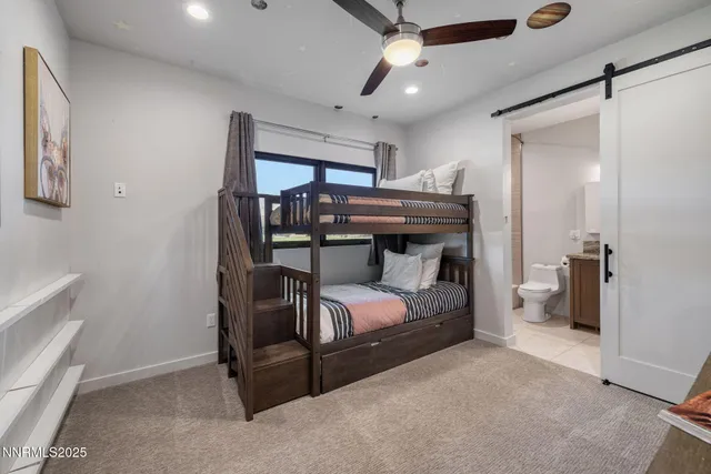 a bedroom with a bed and a tv