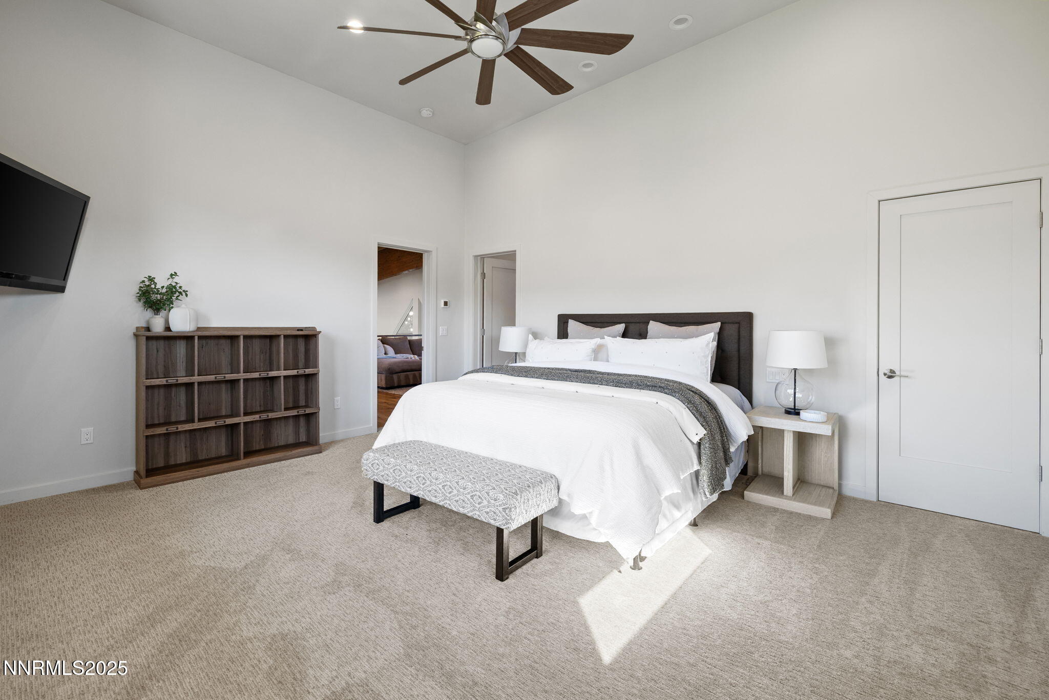 2255 Warrior Lane Reno, NV 89523 - Photo 27 of 52 a bedroom with a bed and a flat screen tv