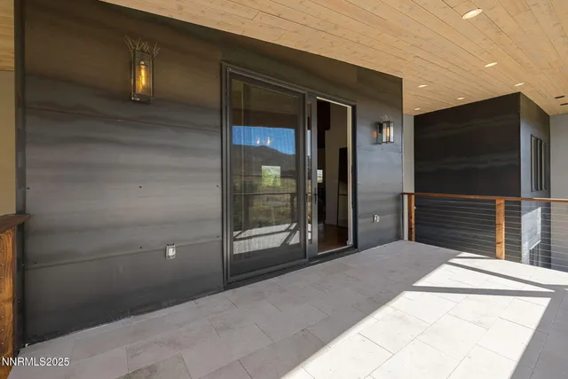 a bedroom with a bed and a television