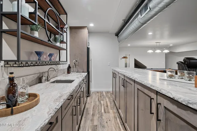 a kitchen with counter space a sink and cabinets