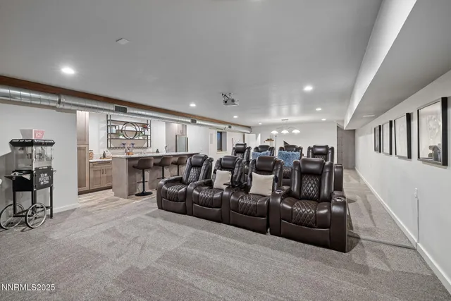 a living room with furniture and a ceiling fan