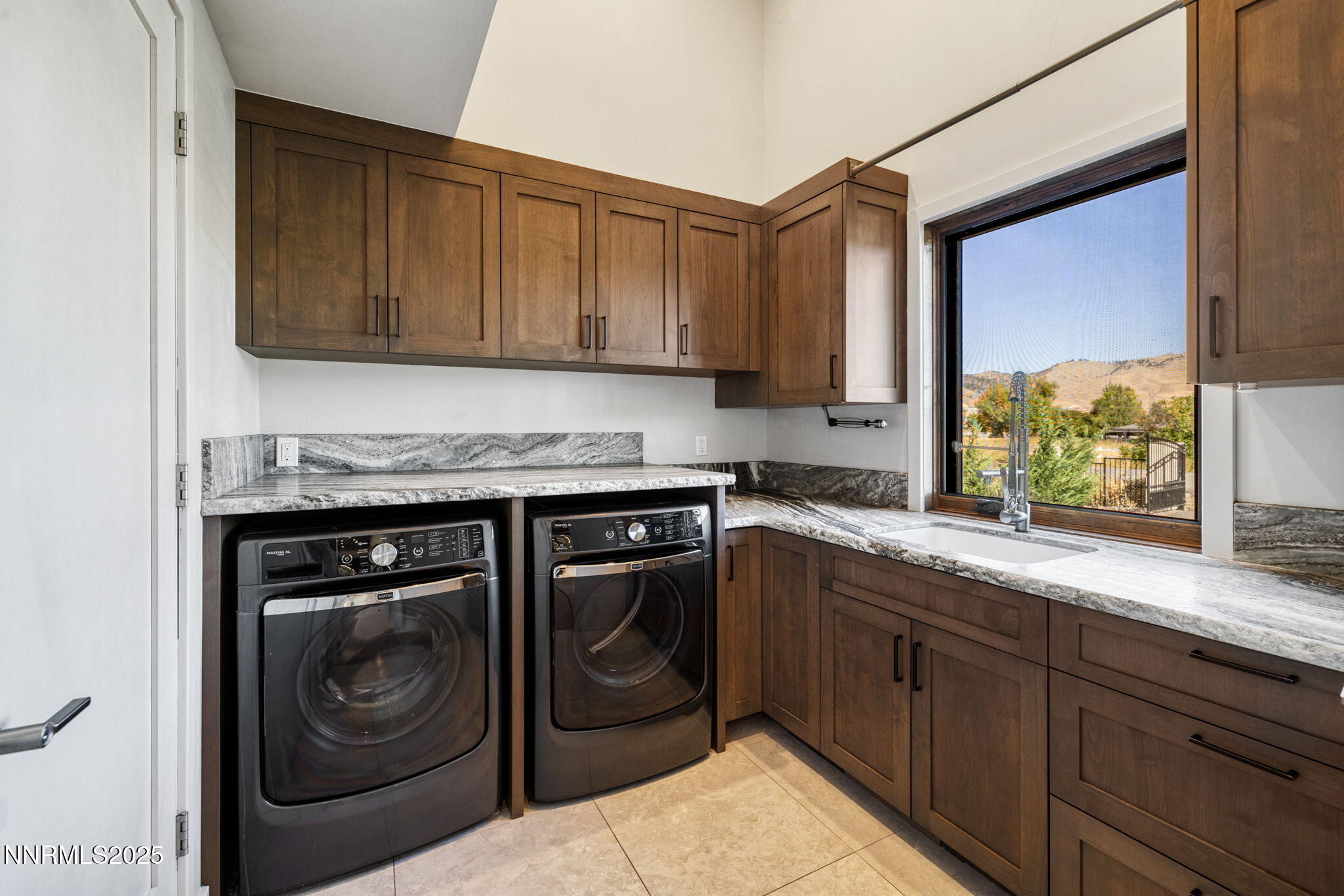 2255 Warrior Lane Reno, NV 89523 - Photo 39 of 52 a kitchen with granite countertop a sink and cabinets