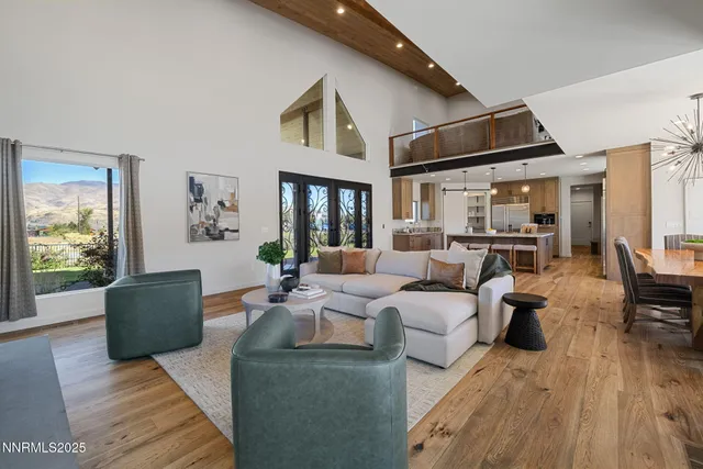 a living room with furniture or couch and a wooden floor