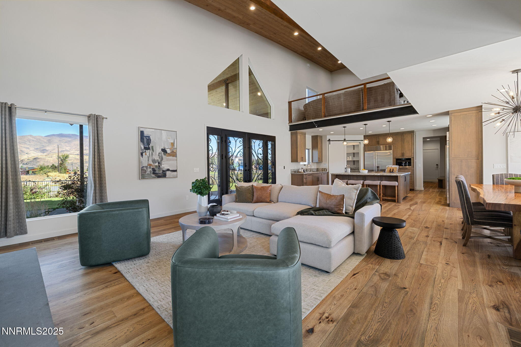 2255 Warrior Lane Reno, NV 89523 - Photo 4 of 52 a living room with furniture or couch and a wooden floor