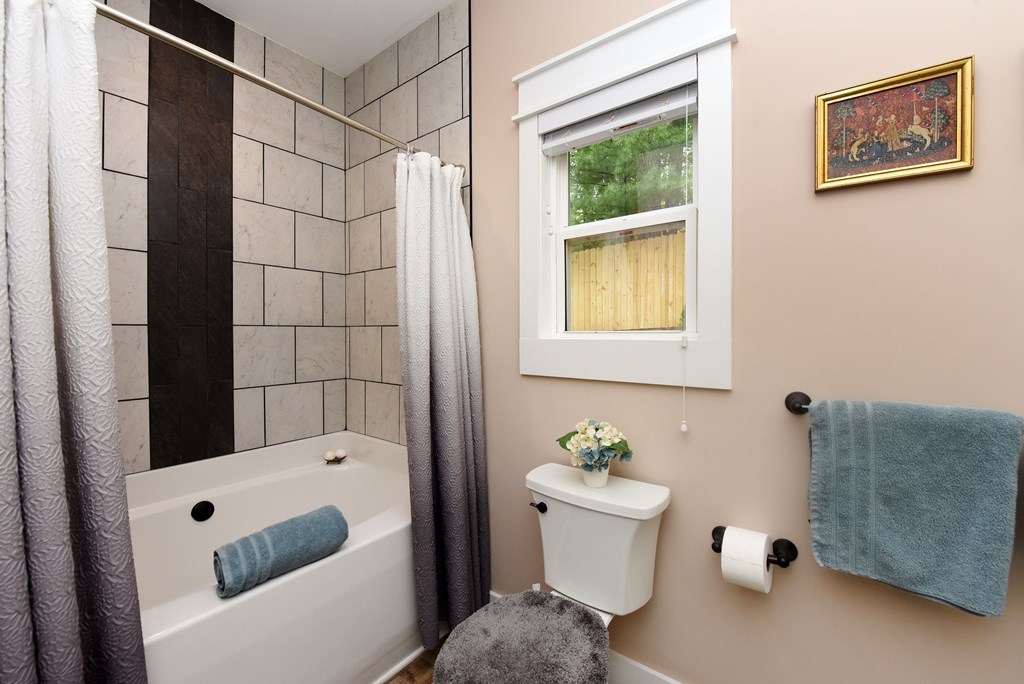83 Highland Road Blairsville, GA 30512 - Photo 23 of 32 a bathroom with a shower a toilet and a sink